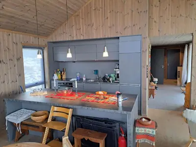 a kitchen with a stove and a counter top at Rabbelia by Norgesbooking - cabin in great hiking and skiing area in Ål