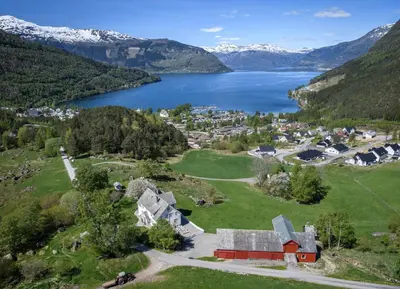 an aerial view of a small town next to a lake at Huse Gjestegard in Kinsarvik
