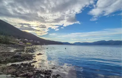 a large body of water with mountains in the background at Amazing Home In Kysnesstrand With Wifi in Oppheim