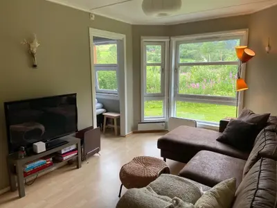 a living room with a couch and a flat screen tv at Actif 318 apartment - close to ski slopes in Ål in Ål