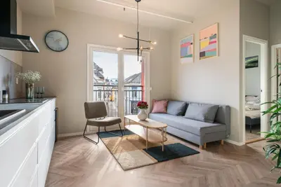 a living room with a couch and a table at 3F - In the heart of Trondheim in Trondheim