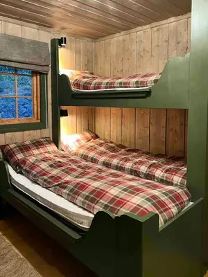 two bunk beds in a cabin with a window at Cabin With Panoramic View At Vaset in Ron