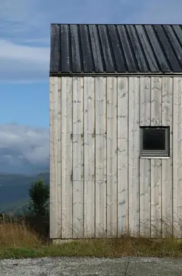 a barn with a window on the side of it at Cabin Overlooking Hallingskarvet National Park in Geilo