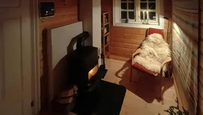 a living room with a couch and a chair at Cabin With Sauna In Vegglifjell in Veggli