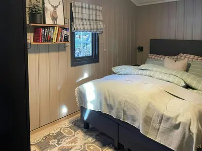a bedroom with a bed and a window at Cabin By The Cross-Country Trails In Norefjell in Eggedal