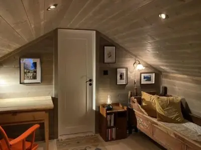 a room with a couch and a table in a room at Traditional Cabin With Views Of Hardangervidda in Uvdal