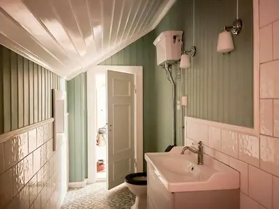 a bathroom with a sink and a toilet at Historic Property In Idyllic Snertingdal in Segard