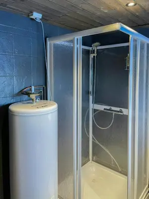 a shower in a bathroom with a toilet and a sink at Log Cabin With Views Over Trysil Mountain in Trysil