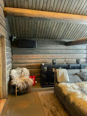 a living room with a couch and a table at Log Cabin With Views Over Trysil Mountain in Trysil