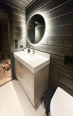 a bathroom with a sink and a mirror at Unique Cabin With Spa And Ski In-Ski Out in Hemsedal