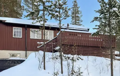 a red house in the snow with trees at 2 Bedroom Pet Friendly Home In Rendalen in Rendalen
