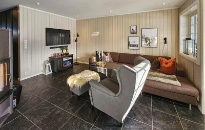 a living room with a couch and a tv at Lovely Apartment In Rjukan With Wifi in Rjukan
