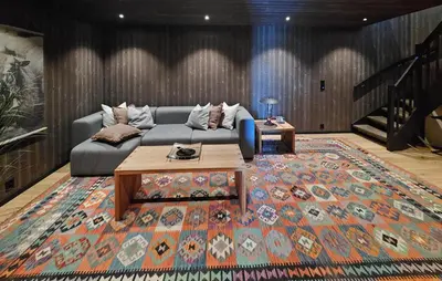 a living room with a couch and a table on a rug at Awesome Home In Rjukan With Sauna in Rjukan
