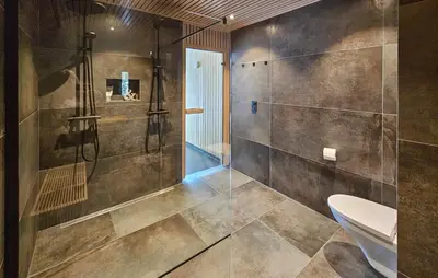 a bathroom with a shower and a toilet at Awesome Home In Rjukan With Sauna in Rjukan