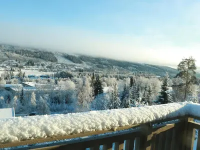 a view of a snow covered valley with trees at Trysil turistesenter hytte in Trysil