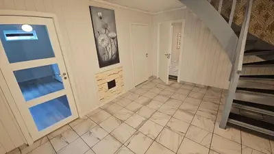 an empty hallway with a staircase and a stair case at Apartment in Rauma in Veblungsnes