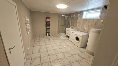 a laundry room with a washer and dryer at Apartment in Rauma in Veblungsnes