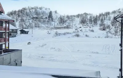 a view of a snow covered field with a ski slope at 5 Bedroom Cozy Apartment In Ustaoset in Ustaoset
