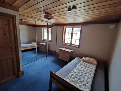 a small room with a bed and a mirror at Hemsedal - 2 bedrooms - WI-FI in Hemsedal
