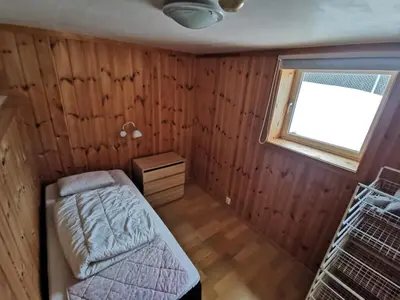 a small bedroom with a bed and a window at Hemsedal - 2 bedrooms - WI-FI in Hemsedal