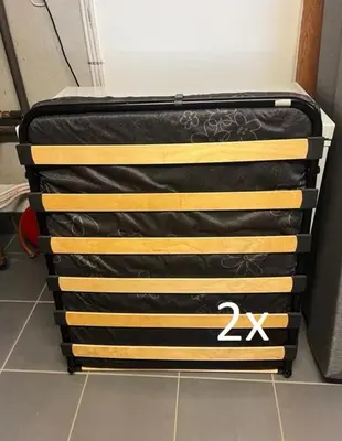 a bed with a black and yellow blanket at Hemsedal - 2 bedrooms - WI-FI in Hemsedal