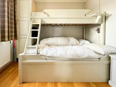 a white bunk bed with a ladder on it at Big And Modern Apartment At Beitostølen in Beitostøl