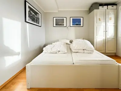 a large white bed in a white room at Big And Modern Apartment At Beitostølen in Beitostøl
