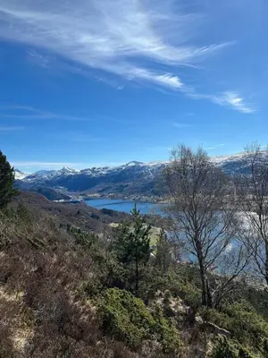 a view of a lake from a hill at Apartment by the fjord, with boat and jacuzzi included in Larsnes