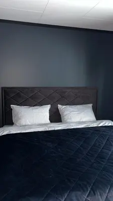 a bed with two pillows on top of it at Lovely apartment in beautiful Loen in Loen