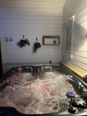 a bath tub filled with water in a room at Lovely apartment in beautiful Loen in Loen