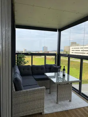a living room with a couch and a table at Apartment in Trondheim, Tiller in Trondheim