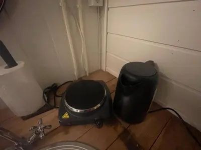 a corner of a room with a blender and a drum at Bekkvang Fjøs Tiny House in Trysil