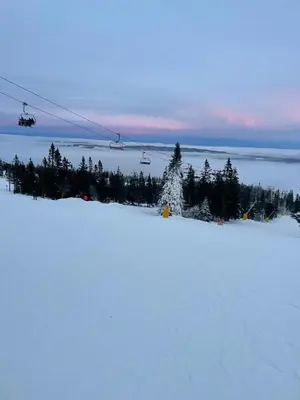 a ski lift flying over a snow covered slope at Bekkvang Fjøs Tiny House in Trysil
