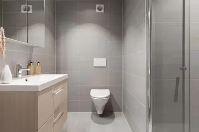 a bathroom with a shower and a toilet and a sink at Urban retreat, traditional wooden house in Bergen in Bergen