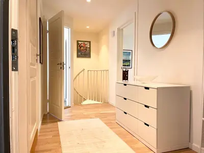 a bathroom with a white dresser and a mirror at Urban retreat, traditional wooden house in Bergen in Bergen