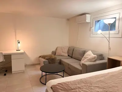 a living room with a couch and a table at Urban retreat, traditional wooden house in Bergen in Bergen