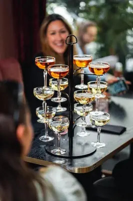 a tray of champagne glasses on a table at DINBNB Apartment l Skansen funhouse - 400m to Bryggen Gym & Parking in Bergen