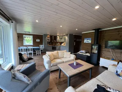 a living room with couches and a table at New Cozy Cabin By Ski Trails And Nature Paths in Beitostøl