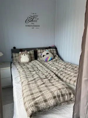 a bed with two hello kitty pillows on it at Koselig rekkehus til leie under ski VM i Trondheim in Trondheim