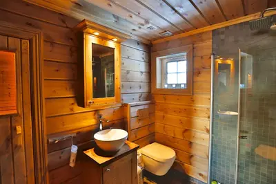 a bathroom with a sink and a toilet and a shower at Relaxing Getaway With Sauna And Terrace in Beitostøl