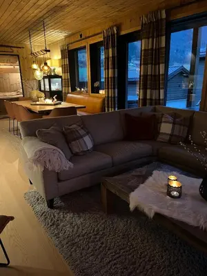 a living room with a couch and a table at Stylish apartment in Myrkdalen in Vossestrand