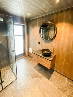 a bathroom with a sink and a mirror at Mountain Cabin At Hardangervidda in Uvdal