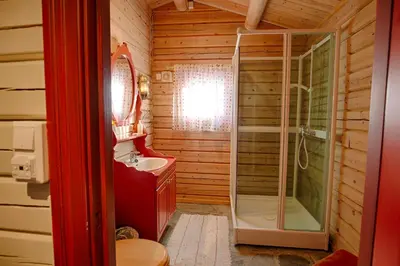 a bathroom with a shower and a sink at Charming Cabin Near Jotunheimen Trails in Beitostøl