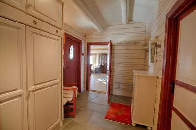 a hallway with a door leading to a room at Charming Cabin Near Jotunheimen Trails in Beitostøl