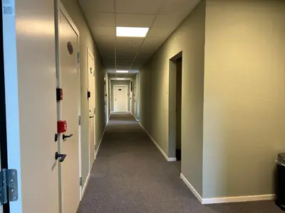 a hallway of an office building with a long corridor at Åndalsnes house in Åndalsnes