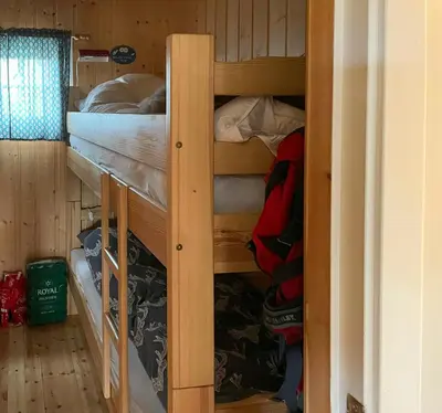 a couple of bunk beds in a cabin at Family Cabin With Sun And Views At Ljøsheim in Mesnali