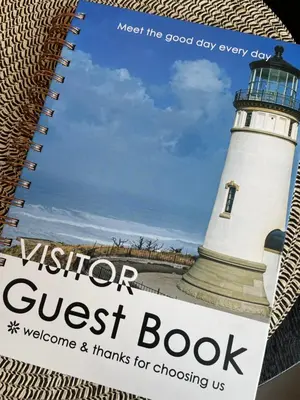 a book with a lighthouse on the cover at Rancho Apartment in Langevåg in Sula