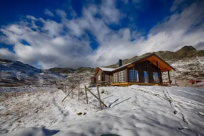 a cabin in the snow on a snowy mountain at Modern Cabin At The Foot Of Bitihorn in Beitostøl