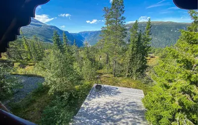 an aerial view of a porch with trees and mountains at Beautiful Home In Rjukan With Wifi in Rjukan