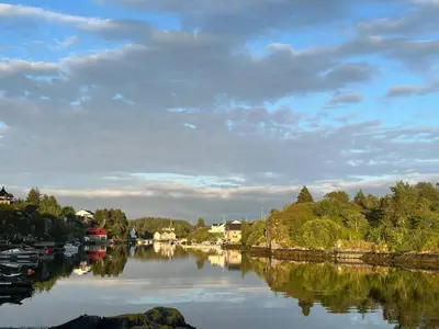a view of a river with boats on it at Seaside Cabin With Archipelago Views In Radøy in Bøvågen